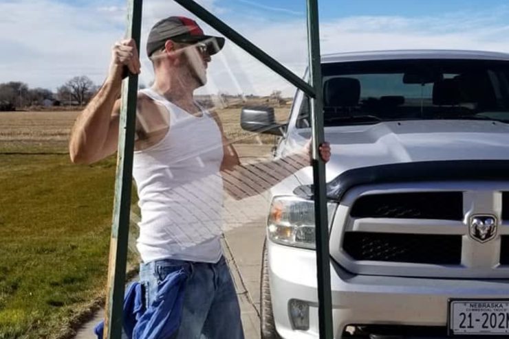 Jo carrying a window